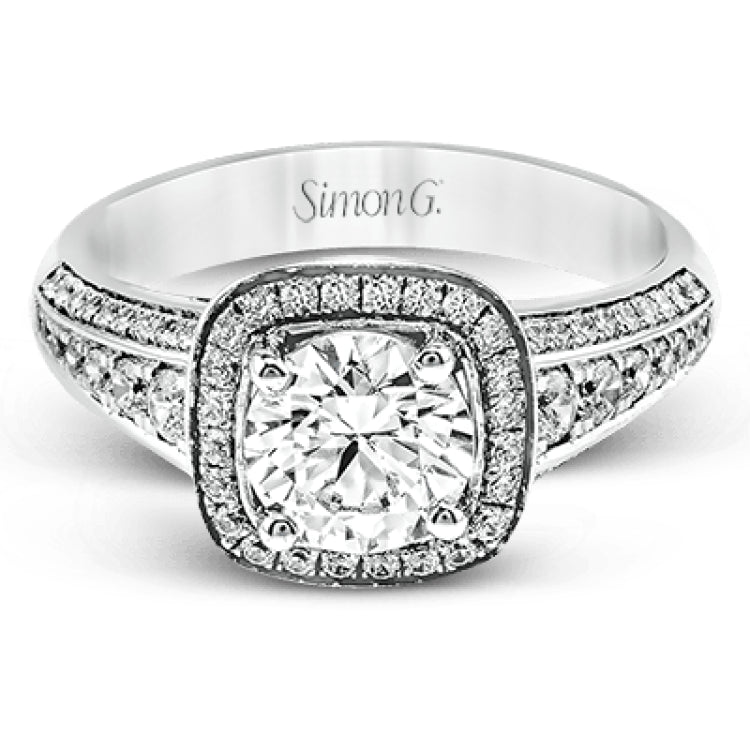The classic design of this white gold engagement ring is emphasized by .44 ctw of dazzling round cut white diamonds.