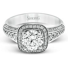 The classic design of this white gold engagement ring is emphasized by .44 ctw of dazzling round cut white diamonds.