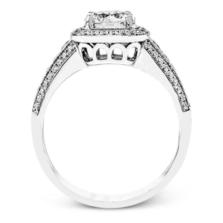 The classic design of this white gold engagement ring is emphasized by .44 ctw of dazzling round cut white diamonds.