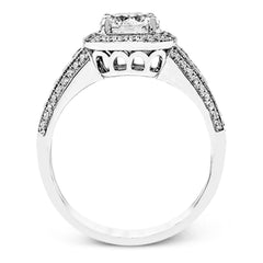 The classic design of this white gold engagement ring is emphasized by .44 ctw of dazzling round cut white diamonds.