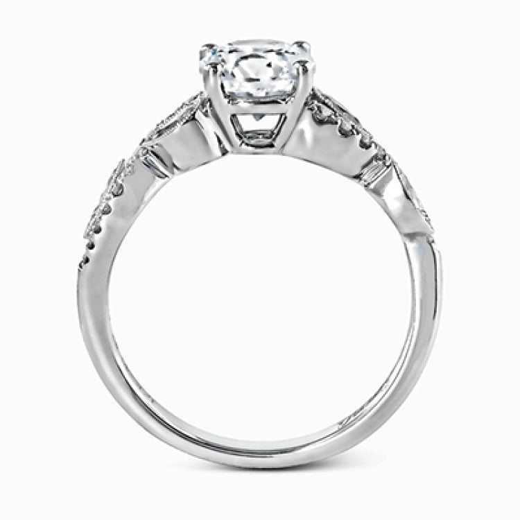 Featuring a distinctively romantic design, this white gold engagement ring and band are set with .22 ctw of round cut white diamonds, .09 ctw of marquise cut diamonds, and .13 ctw pear-shaped diamonds.