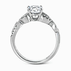 Featuring a distinctively romantic design, this white gold engagement ring and band are set with .22 ctw of round cut white diamonds, .09 ctw of marquise cut diamonds, and .13 ctw pear-shaped diamonds.