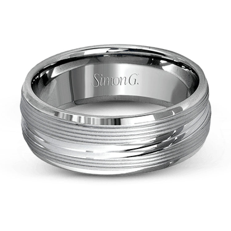 A contemporary ribbed design in lustrous white gold is outlined with two exquisite yellow gold bands in this striking men's wedding band.