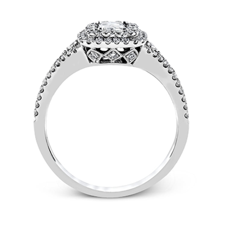 This show-stopping white gold ring features intricately detailed halo and sides containing a total of .61 ctw in round white diamonds.