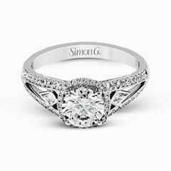 This elegant white gold ring features a lovely vintage style accentuated by .27 ctw of round cut white diamonds and .11 ctw of kite shaped diamonds.