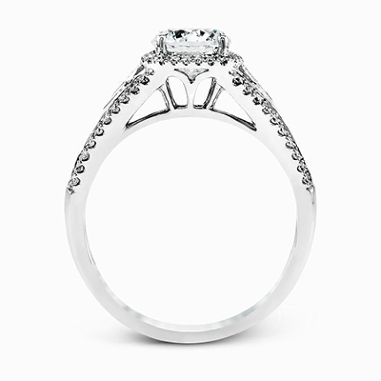 This elegant white gold ring features a lovely vintage style accentuated by .27 ctw of round cut white diamonds and .11 ctw of kite shaped diamonds.