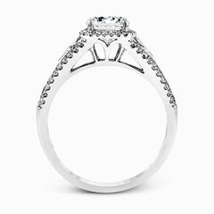 This elegant white gold ring features a lovely vintage style accentuated by .27 ctw of round cut white diamonds and .11 ctw of kite shaped diamonds.