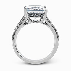 This lovely classic white gold engagement ring is accentuated by .34 ctw of round cut white diamonds in an eye-catching openwork design.