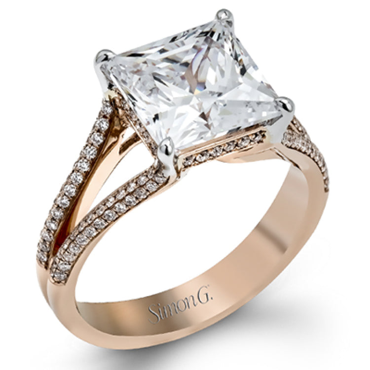 This lovely classic white gold engagement ring is accentuated by .34 ctw of round cut white diamonds in an eye-catching openwork design.