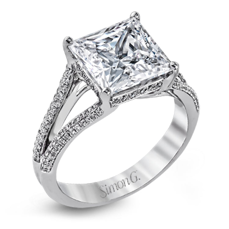 This lovely classic white gold engagement ring is accentuated by .34 ctw of round cut white diamonds in an eye-catching openwork design.