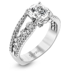 The lovely vintage style of this white gold engagement ring is further enhanced by .91 ctw of shimmering round cut diamonds.