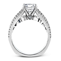 The lovely vintage style of this white gold engagement ring is further enhanced by .91 ctw of shimmering round cut diamonds.