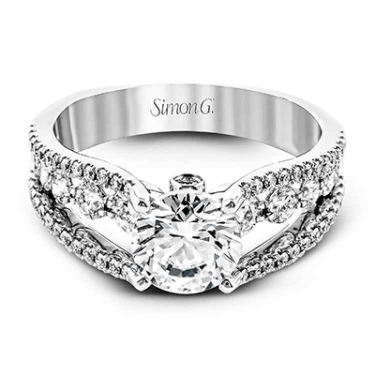 The lovely vintage style of this white gold engagement ring is further enhanced by .91 ctw of shimmering round cut diamonds.