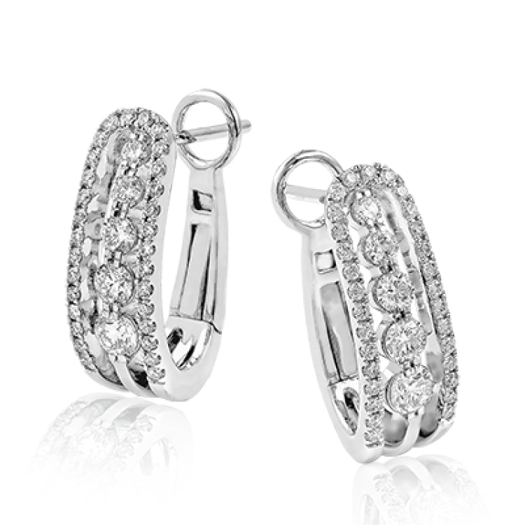 Featuring a classic hoop design, these elegant white gold earrings are complemented by .66 ctw sparkling round cut white diamonds.