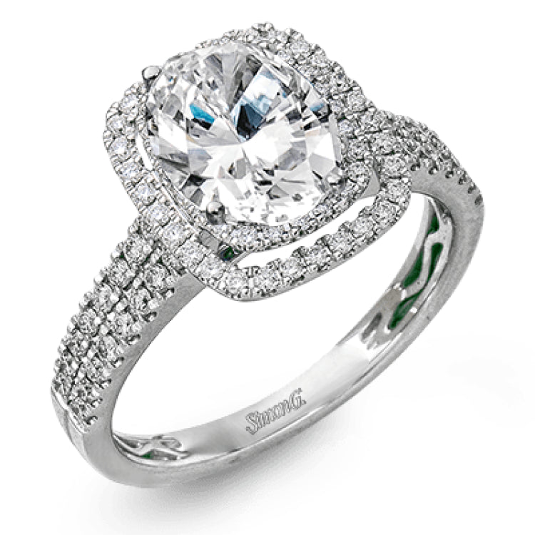 This arresting white gold ring features a classic design set with a 1.90 ctw natural sapphire silhouetted by twin silhouettes accented by .51 ctw of round white diamonds.