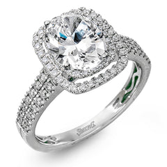 This arresting white gold ring features a classic design set with a 1.90 ctw natural sapphire silhouetted by twin silhouettes accented by .51 ctw of round white diamonds.
