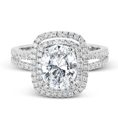 This arresting white gold ring features a classic design set with a 1.90 ctw natural sapphire silhouetted by twin silhouettes accented by .51 ctw of round white diamonds.