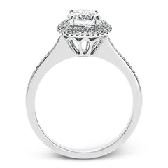 Classy and elegant, this contemporary white gold halo engagement ring and wedding band set is set with .34 ctw of round cut white diamonds.