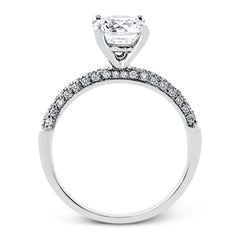 This impressive contemporary white gold engagement ring and wedding band set are emphasized by 1.00 ctw of dazzling round cut white diamonds.