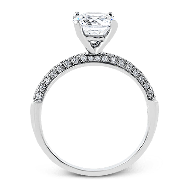 This impressive contemporary white gold engagement ring and wedding band set are emphasized by 1.00 ctw of dazzling round cut white diamonds.