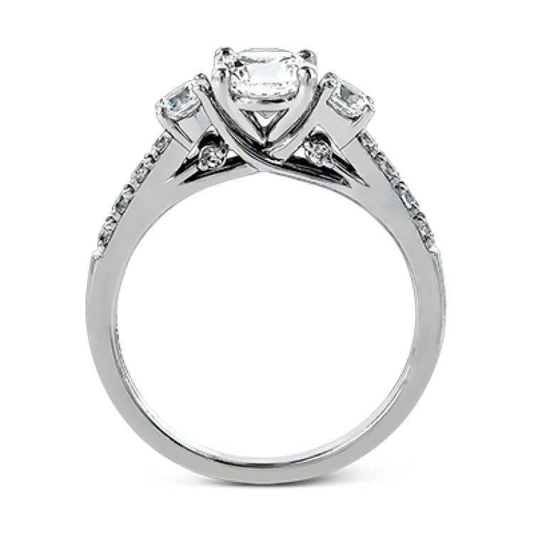 This classic three-stone engagement ring features .24 ctw of round brilliant side stones and .23 ctw of white diamonds extending down the sides.
