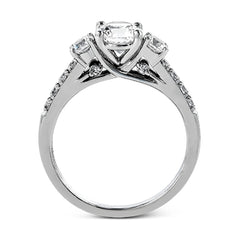 This classic three-stone engagement ring features .24 ctw of round brilliant side stones and .23 ctw of white diamonds extending down the sides.