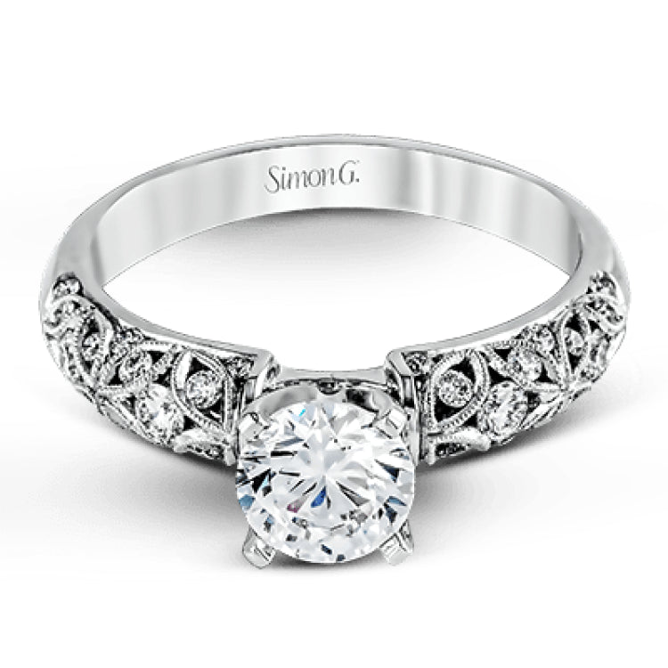 Featuring a delicate floral design, this white gold vintage engagement ring is set with .35 ctw of shimmering white diamonds.