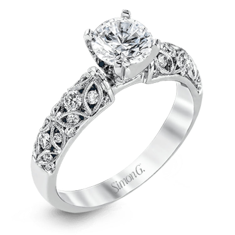 Featuring a delicate floral design, this white gold vintage engagement ring is set with .35 ctw of shimmering white diamonds.
