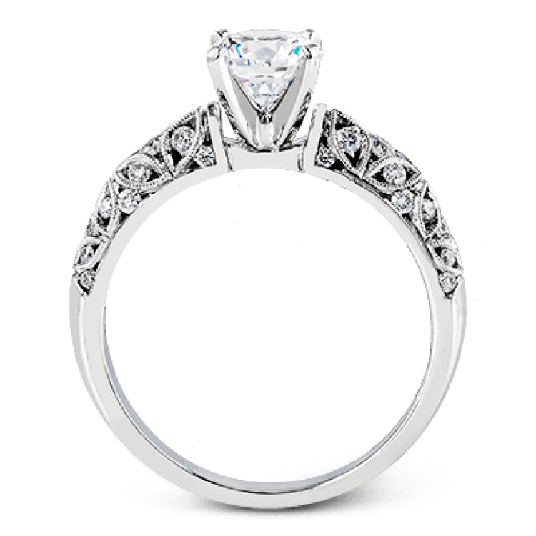 Featuring a delicate floral design, this white gold vintage engagement ring is set with .35 ctw of shimmering white diamonds.