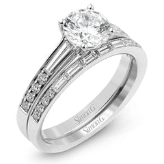 This dazzling white gold wedding set is enhanced by .21 ctw round cut white diamonds with side accents of .53 ctw of baguette cut diamonds.