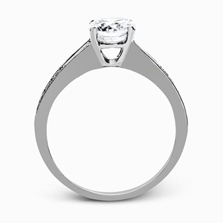 This dazzling white gold wedding set is enhanced by .21 ctw round cut white diamonds with side accents of .53 ctw of baguette cut diamonds.