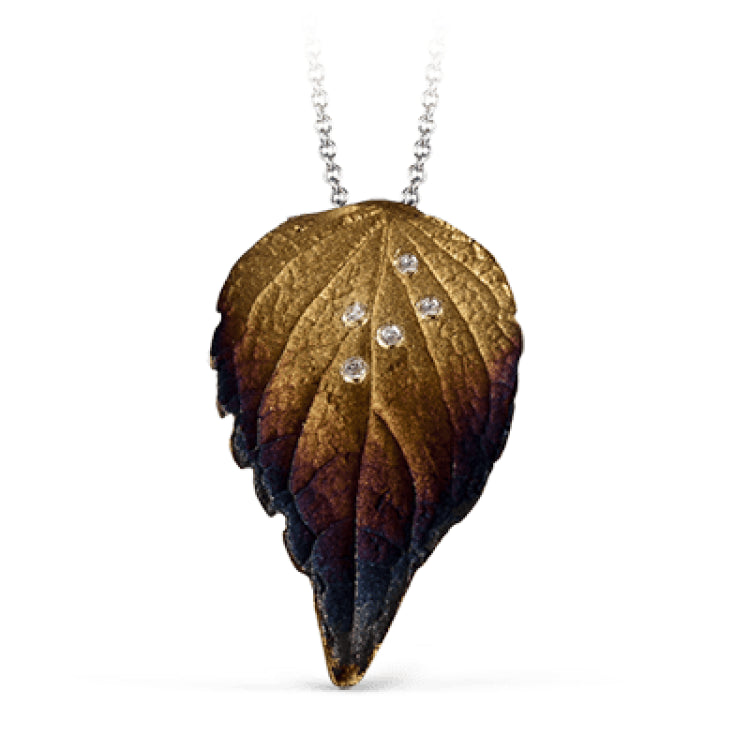 Featuring an incredibly delicate and realistic leaf design, this pendant is set with .04 ctw of sparkling round white diamonds.