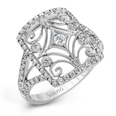 The intricate design of this vintage style white gold ring is enhanced by .64 ctw of glistening round cut white diamonds.