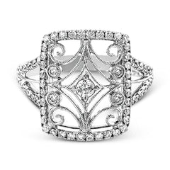 The intricate design of this vintage style white gold ring is enhanced by .64 ctw of glistening round cut white diamonds.