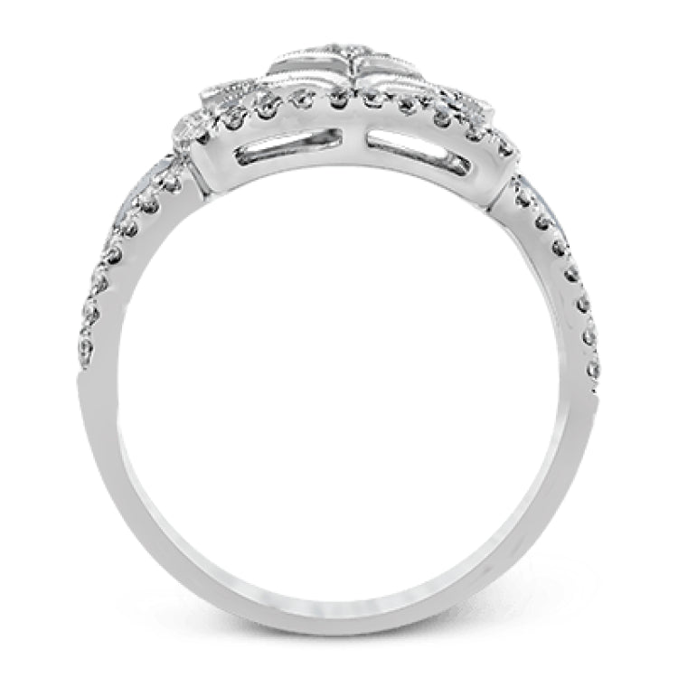 The intricate design of this vintage style white gold ring is enhanced by .64 ctw of glistening round cut white diamonds.