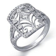 The intricate design of this vintage style white gold ring is enhanced by .64 ctw of glistening round cut white diamonds.
