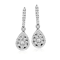 The dazzling teardrop design of these exquisite white gold earrings are accented by 1.07 ctw of round white diamonds, creating a memorable look.