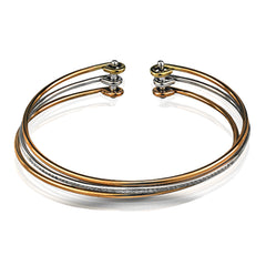Reflecting an eye-catching but simple contemporary design, this three-tone open-style bangle bracelet is accentuated by .22 ctw of white diamonds.