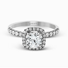This elegant classic white gold halo engagement ring and band is set with .78 ctw of sparkling round cut white diamonds.
