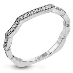 Featuring an elegant twisted contemporary design, this white and rose gold engagement ring complemented by .51 ctw of shimmering round cut white diamonds.