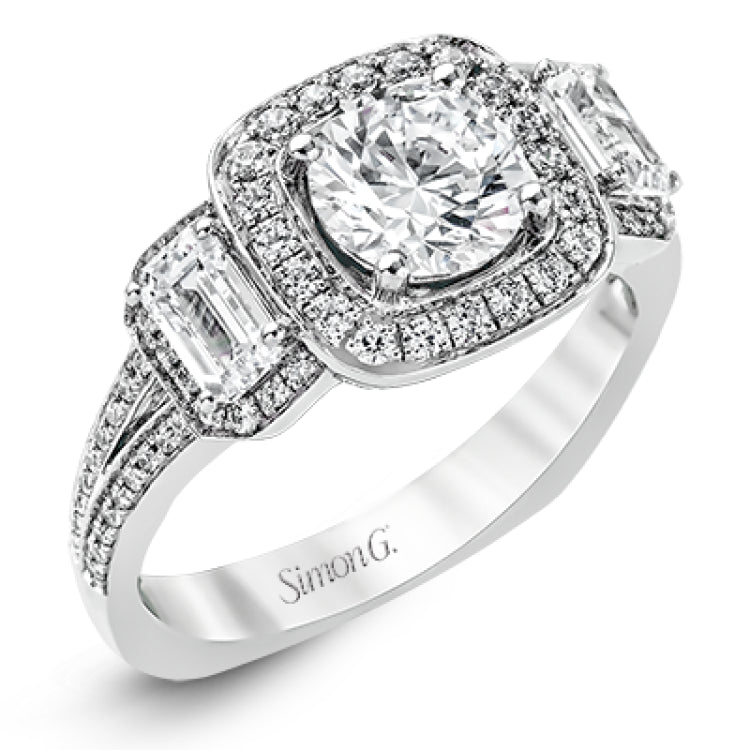 This impressive white gold ring features .43 ctw emerald cut side diamonds and is accented with .38 ctw round cut diamonds.