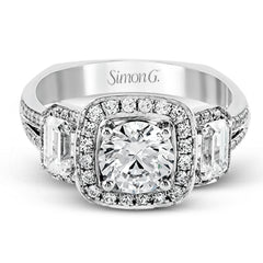 This impressive white gold ring features .43 ctw emerald cut side diamonds and is accented with .38 ctw round cut diamonds.