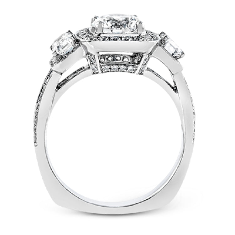 This impressive white gold ring features .43 ctw emerald cut side diamonds and is accented with .38 ctw round cut diamonds.
