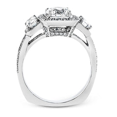 This impressive white gold ring features .43 ctw emerald cut side diamonds and is accented with .38 ctw round cut diamonds.