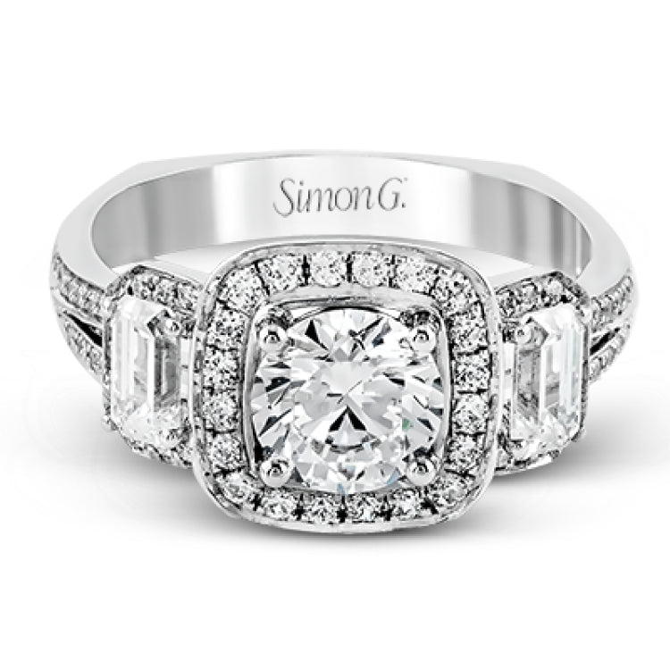 This impressive white gold ring features .43 ctw emerald cut side diamonds and is accented with .38 ctw round cut diamonds.