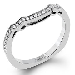 This impressive white gold ring features .43 ctw emerald cut side diamonds and is accented with .38 ctw round cut diamonds.