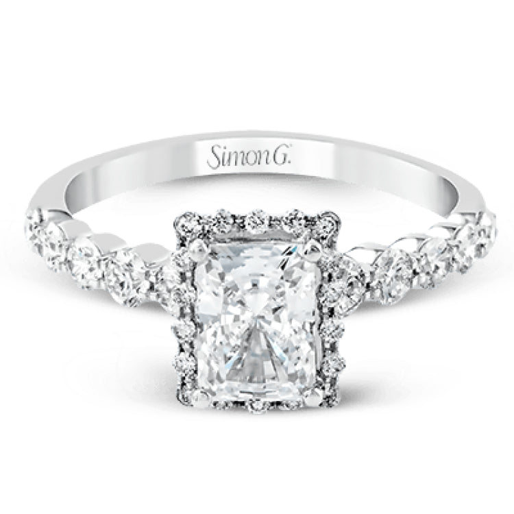 Featuring a delicate contemporary design, this brilliant white gold engagement ring is highlighted by .64 ctw of round cut white diamonds in an eye-catching geometric setting.