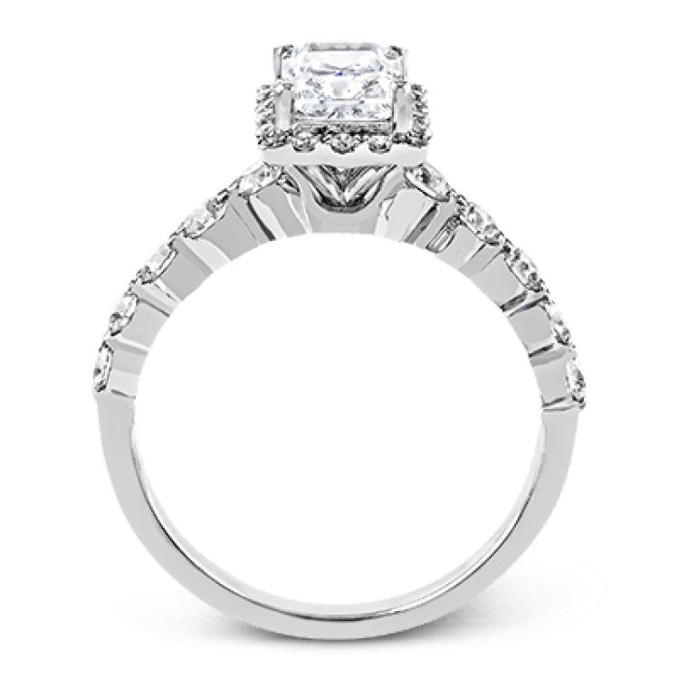 Featuring a delicate contemporary design, this brilliant white gold engagement ring is highlighted by .64 ctw of round cut white diamonds in an eye-catching geometric setting.