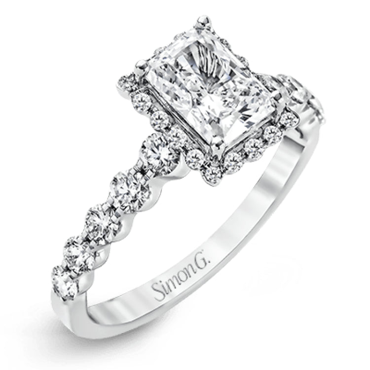 Featuring a delicate contemporary design, this brilliant white gold engagement ring is highlighted by .64 ctw of round cut white diamonds in an eye-catching geometric setting.