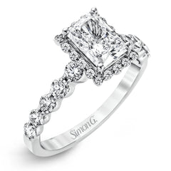 Featuring a delicate contemporary design, this brilliant white gold engagement ring is highlighted by .64 ctw of round cut white diamonds in an eye-catching geometric setting.